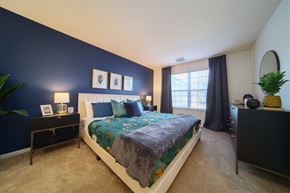 Greenfield apartment for rent - a bedroom with a bed and a window