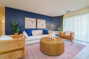 Greenfield apartment for rent - a living room with blue walls and a white couch