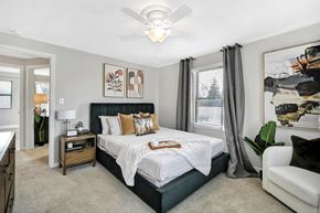 Oak Park apartment for rent - a bedroom with a bed and a ceiling fan