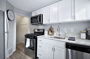 Oak Park apartment for rent - a kitchen with stainless steel appliances and white cabinets