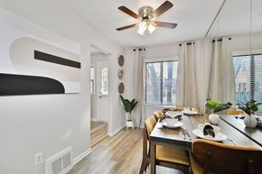 Oak Park apartment for rent - a dining room with a table and a ceiling fan