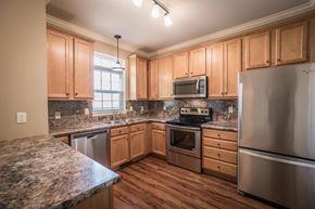 Lilitz townhouse for rent - A kitchen with wooden cabinets and stainless steel appliances at Highlands at Warwick Apartments, Lilitz, 17543