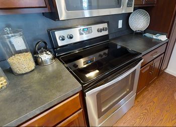 A modern kitchen with a black stove top oven