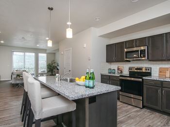Kitchen island with pendant lighting and bar seating