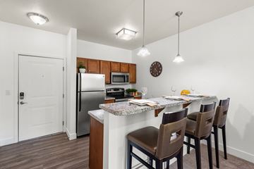 Salt Lake City apartment for rent - A kitchen with a table set for four.