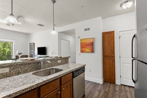 Salt Lake City apartment for rent - A kitchen with granite countertops and stainless steel appliances.