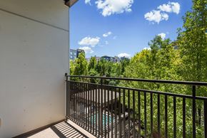 Salt Lake City apartment for rent - Balcony with metal railing overlooking trees at Liberty Gateway Apartments, Salt Lake City, 84101