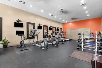 24-Hour fitness center with cardio & weight equipment