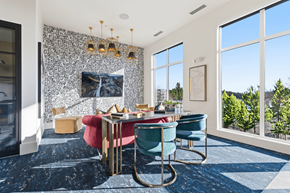 Salt Lake City apartment for rent - A dining room with a red table and blue chairs.