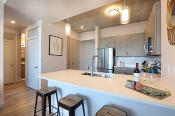 Modern kitchen island with white quartz countertop