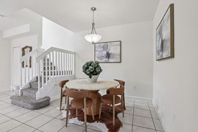 Homestead townhouse for rent - A dining room with a table and chairs.