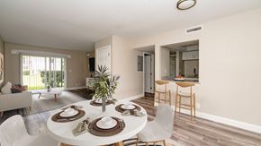 Daytona Beach apartment for rent - A dining room with a white table set for six.