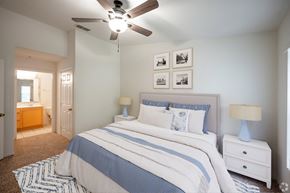 Orange City apartment for rent - a bedroom with a bed and a ceiling fan