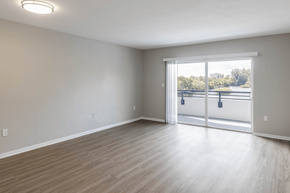 North Miami apartment for rent - a bedroom with a sliding glass door and hardwood floors at Lakeside @ Biscayne Gardens,North Miami