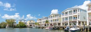 Marathon apartment for rent - A row of houses are built on stilts over a body of water.