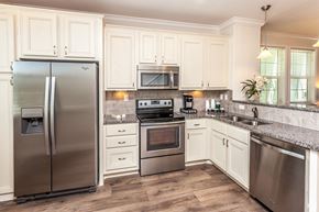 Marathon apartment for rent - A kitchen with a stainless steel refrigerator and oven.