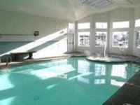 Fife apartment for rent - A large indoor swimming pool with sunlight streaming in through the windows.
