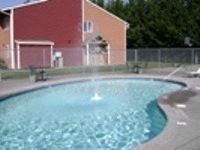Tacoma apartment for rent - A small pool with a fountain in the middle.