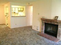 Fife apartment for rent - A living room with a fireplace and a painting on the wall.
