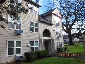 Portland apartment for rent - the outside of a house with a lawn and trees