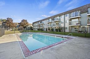 Medford apartment for rent - a swimming pool in front of an apartment building