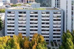 Portland apartment for rent - an aerial view of a large building surrounded by trees