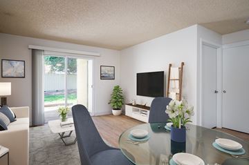 Clatskanie apartment for rent - A modern living room with a glass table and grey chairs.