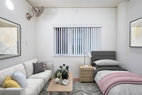 Portland apartment for rent - a bedroom with a bed and couch
