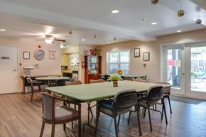 Beaverton apartment for rent - A dining room with a green table and chairs.