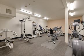 Gresham apartment for rent - A gym with a variety of equipment including a treadmill, weights, and a stationary bike.