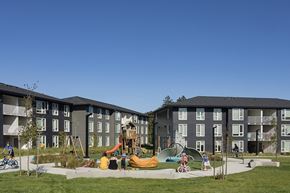 St Helens townhouse for rent - A playground area in front of apartment buildings.