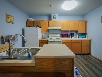Community room - community room includes full kitchen, dining room, living room with cable, and coffee bar.