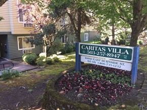 Portland apartment for rent - a sign for the caritas villa subdivision in front of a house