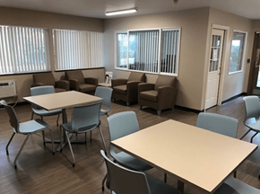 Portland apartment for rent - a dining room with tables and chairs and a seating area