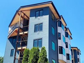 Portland apartment for rent - a tall apartment building with scaffolding on top of it