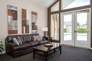 Hillsboro apartment for rent - A living room with a brown couch and a coffee table.