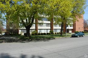 Spokane apartment for rent - A tree with yellow leaves is in front of a building.