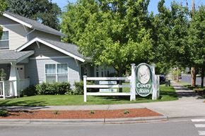 Forest Grove townhouse for rent - A sign for Covey Run is in front of a house.