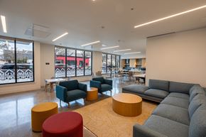 Portland apartment for rent - a lounge area with couches and chairs and tables in a lobby