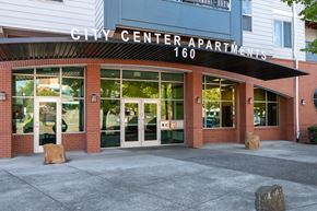 Hillsboro apartment for rent - The front of the City Center Apartments building with the number 160 on it.