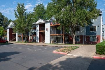 Tualatin apartment for rent - A parking lot with a building in the background.