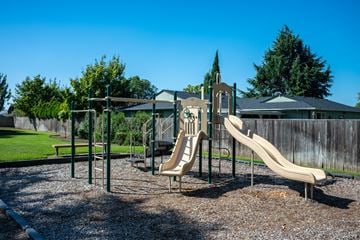 Albany apartment for rent - A playground with a slide and a swing set.