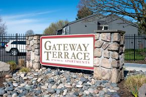 Portland apartment for rent - A sign for Gateway Terrace Apartments in front of a building.