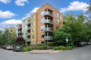 Portland apartment for rent - Apartment building with cars parked in front.