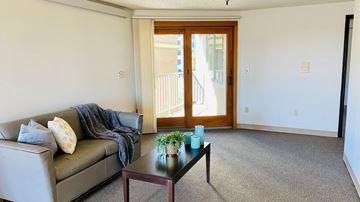 Portland apartment for rent - a living room with a couch and a coffee table