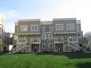 Portland apartment for rent - a large apartment building with a yard in front of it