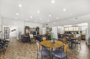 Rio Rancho apartment for rent - A dining room with a table surrounded by chairs.