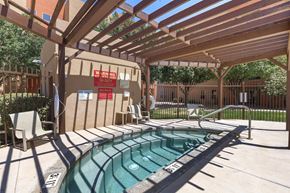 Albuquerque apartment for rent - A pool with a wooden pergola over it.