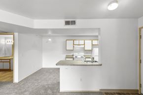Albuquerque apartment for rent - A kitchen with white cabinets and a window above the counter.