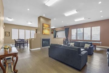 Albuquerque apartment for rent - A living room with a grey couch and a wooden table.